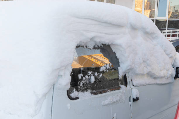 istock old white abandoned broken rusty car parked by the road under a large layer of snow on a bright winter day 1302093659