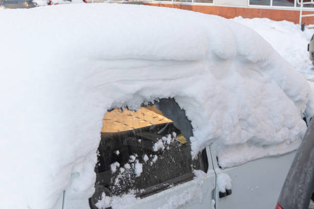istock old white abandoned broken rusty car parked by the road under a large layer of snow on a bright winter day 1302093680