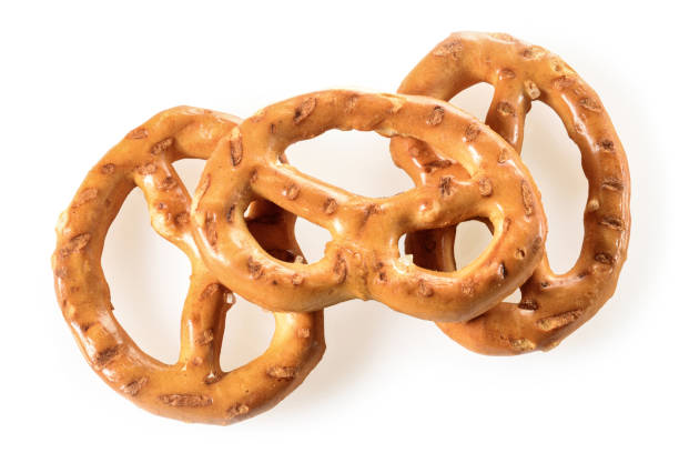 istock Pretzels, three mini snacks with salt for beer. Savory backed beer snack. Macro close-up isolated on white background 1302094754