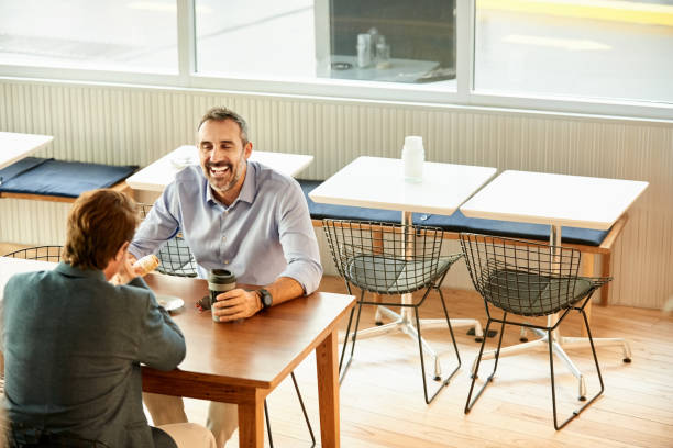 istock Two men in a coffee shop 1302095854