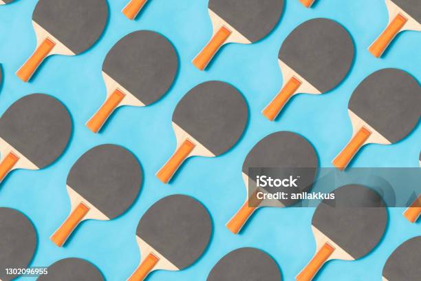 Ping Pong Paddle On Blue Background Stock Photo - Download Image Now - Table Tennis, Pattern, Table Tennis Racket