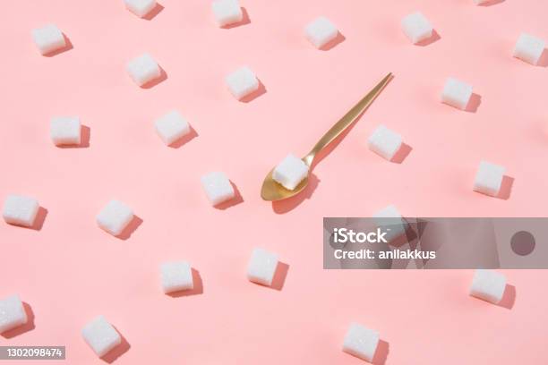 Geometry Pattern Made Of White Sugar Cubes On Pink Background Stock Photo - Download Image Now