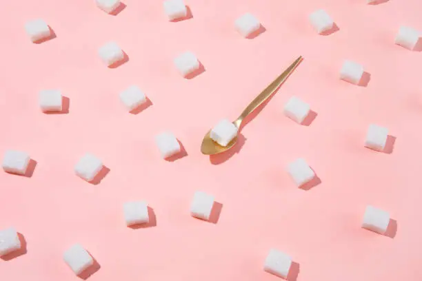 Photo of Geometry Pattern Made of White Sugar Cubes on Pink Background