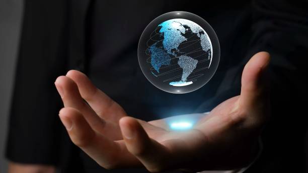 istock Human hand holding earth globe holographic technology 1302098496