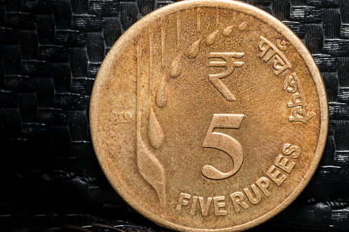 macro photo of a used 5 rupee Indian coin