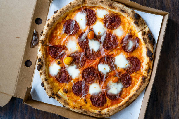 istock Take Away Pepperoni Pizza with Mozzarella Cheese in Take Out Box. 1302098973