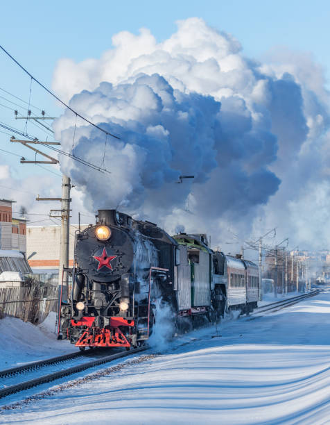 istock Retro train moves at winter day. 1302098975