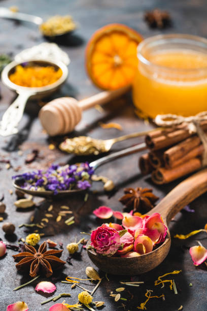 istock Dried herbal tea with honey featuring rose petals tea and mallow 1302104342