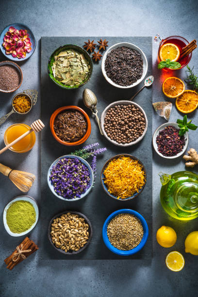 istock Assorted tea and herbs infusion on black slate tray 1302104526