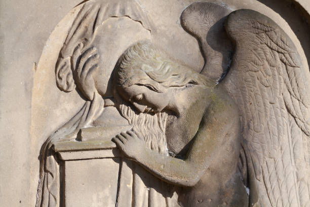 istock Griefing angel at tombstone from 19th century 1302104528