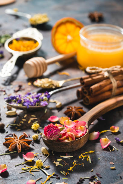 istock Dried herbal tea with honey featuring rose petals tea and mallow 1302104742
