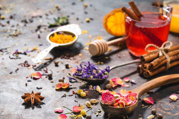 istock Black tea cup and herbal tea featuring rose petals tea and mallow 1302104789