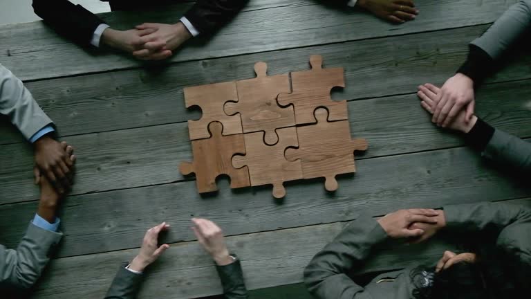 Business teamwork with puzzle