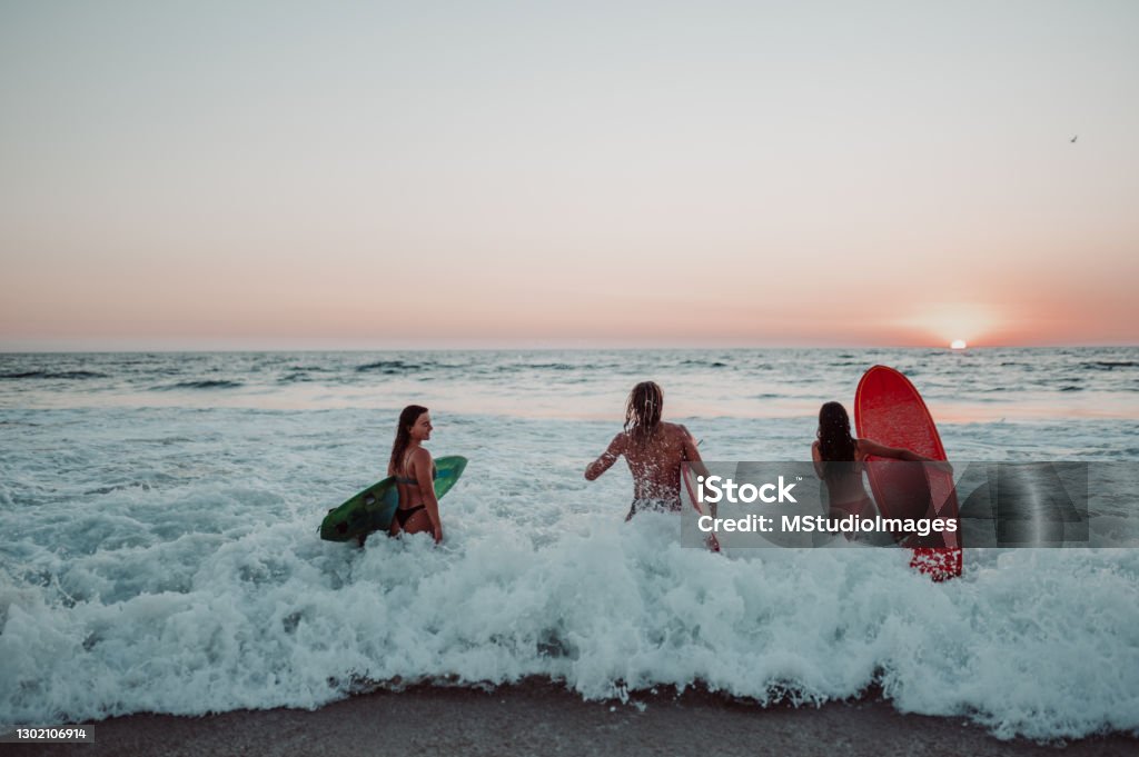 Catch the wave Surfers catching the wave Mexico Stock Photo