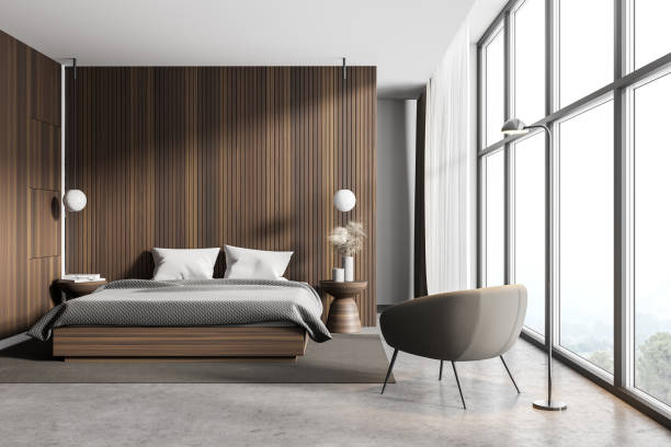 istock Wooden master bedroom interior with armchair 1302108100