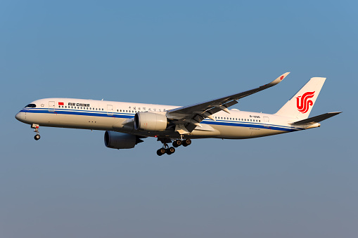 An Airbus A350 operated by Air China lands in Shanghai airport.