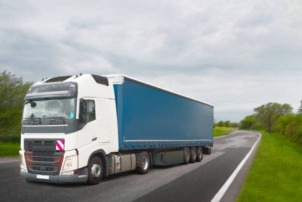 semi truck driving on the road