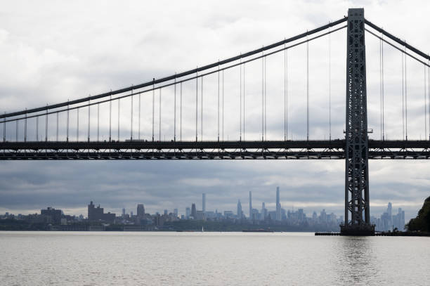NYC skyline framed by George Washington Bridge stock photo