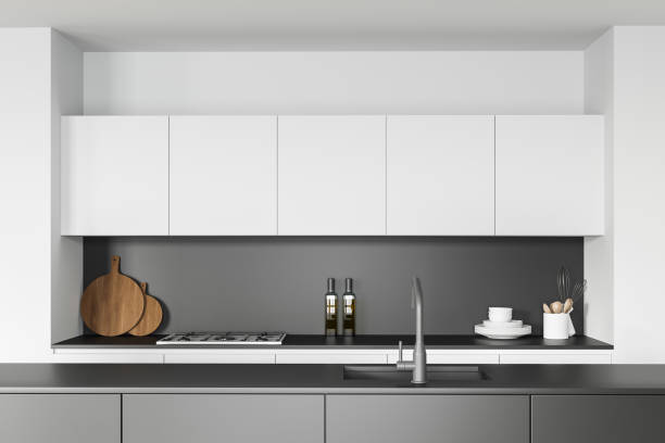 istock White and green kitchen interior with island, close up 1302111577