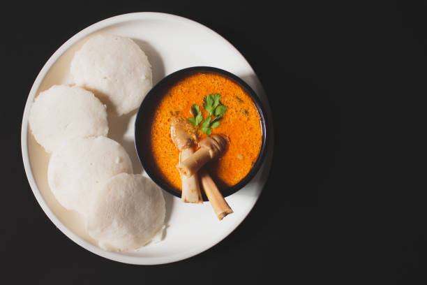 istock Idly with Indian style spicy Mutton or Lamb curry. Top view, flat lay 1302113297