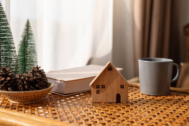 istock Wooden house model on the table 1302114231