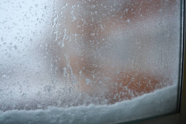 istock Snow piled up outside the window 1302114241