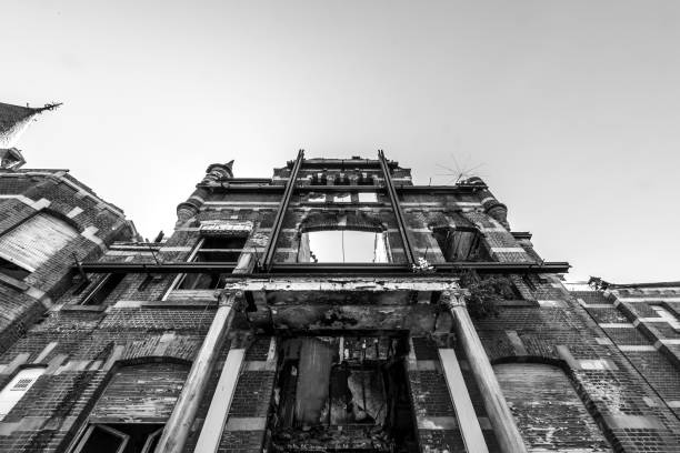 istock View of a decayed facade supported by beams in monochrome 1302115499