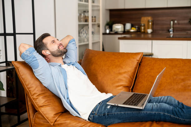 istock Handsome bearded guy wearing casual shirt using laptop 1302115887