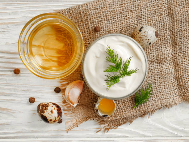 istock homemade mayonnaise, quail eggs on wooden background 1302117121