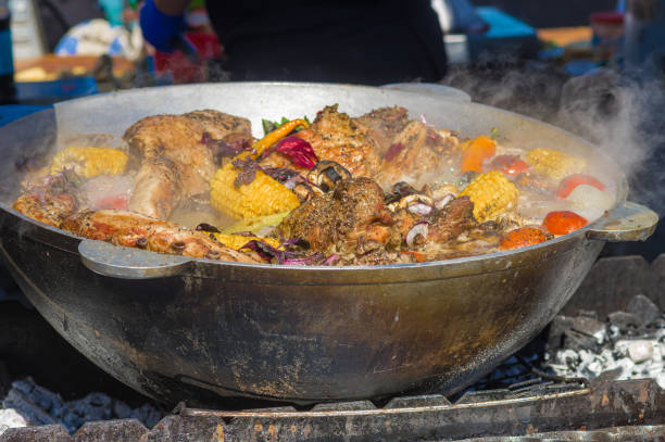 istock pork knuckle boiled with vegetables in big metal cauldron 1302117261
