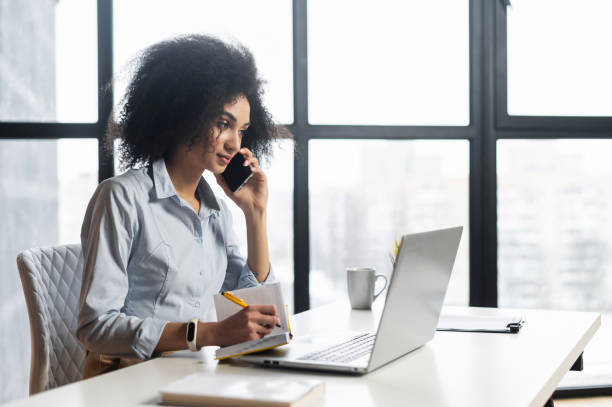 istock Smart teacher writing down the time of lessons 1302119691