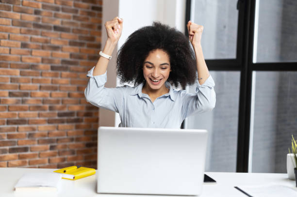 istock Happy young woman hands up 1302119798