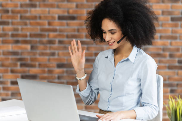 istock American woman chatting with headset 1302119874