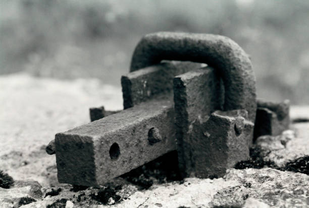 a black and white fragment of an old metal part for mounting on a stone building a black and white fragment of an old metal part for mounting on a stone building halle north rhine westphalia stock pictures, royalty-free photos & images