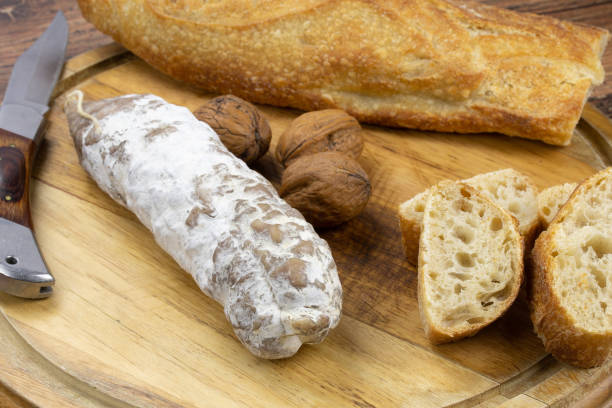 istock dry sausage on a board 1302121520