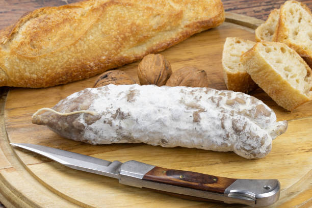istock dry sausage on a board 1302122112