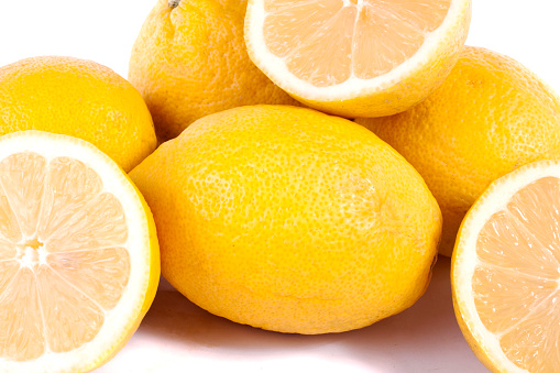 Close up view of bunch of lemons isolated on a white background.
