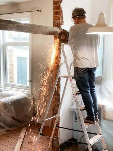 Using angle-grinder to remove beam