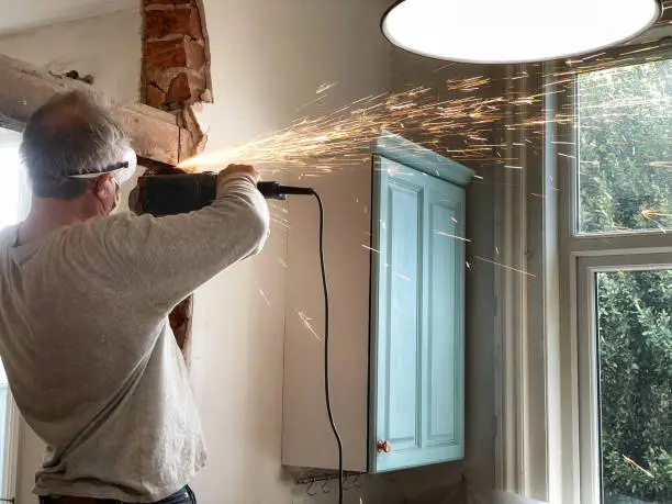 Using angle-grinder to remove beam