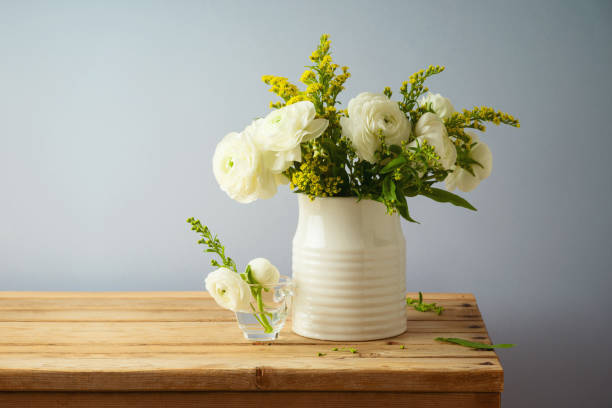 istock Beautiful spring flower bouquet on wooden table 1302123603