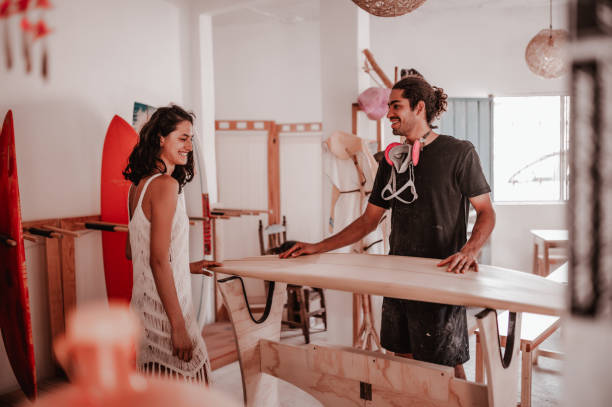 istock Young worker speaking with woman about her purchase 1302123643