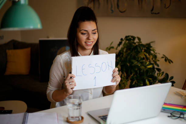 istock Professor using computer and teaching her students online from home. stock photo 1302125071