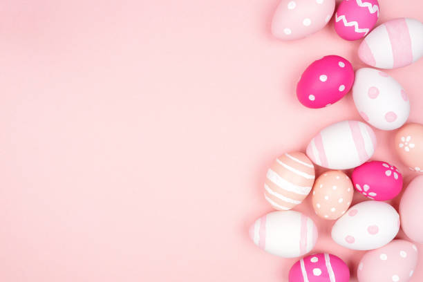 istock Pink and white Easter Egg side border over a pink background 1302125717