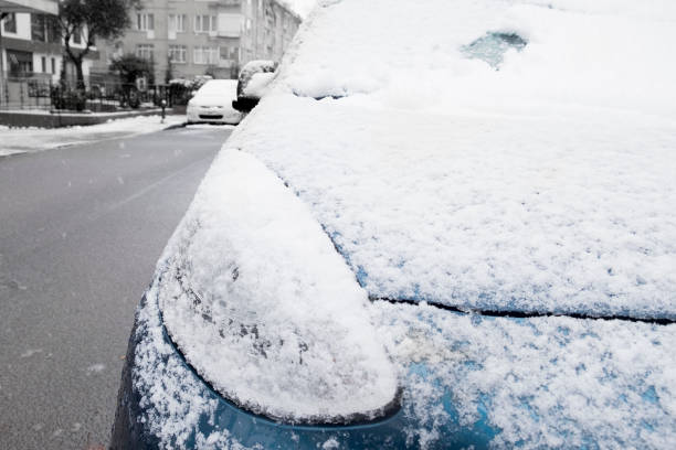 car covered with snow in winter time - snow driving side view mirror rain imagens e fotografias de stock