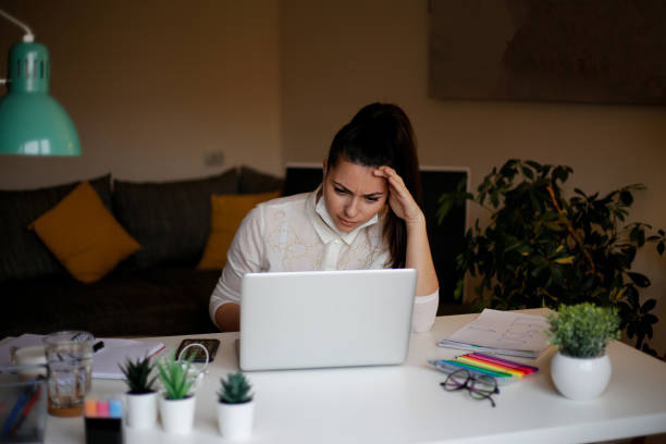 istock Female executive doing paperwork at workplace stock photo 1302126042