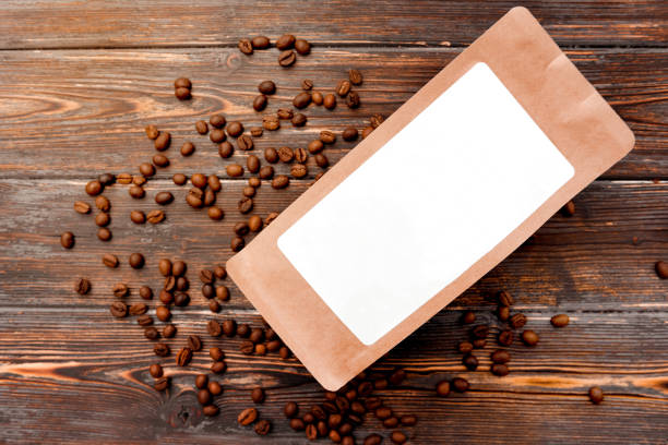 istock paper craft pack on a brown wooden background with coffee beans 1302126130