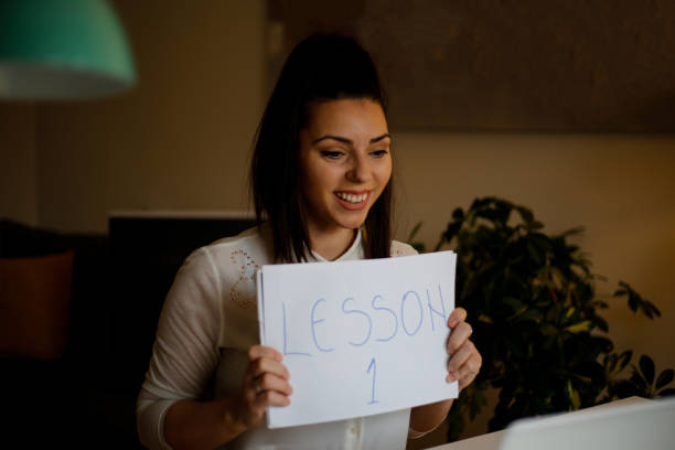 istock Professor using computer and teaching her students online from home. stock photo 1302126207