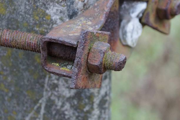 istock old long rusty brown metal construction from a nut and a bolt 1302126238