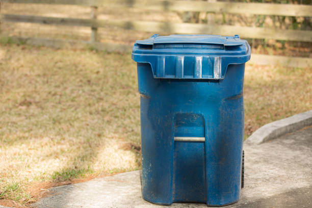 istock Recycle garbage bin sits on curb in suburban district. 1302132708