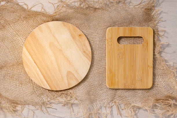 istock empty wooden cutting boards on a light background with space for copying text. flat lay 1302132893